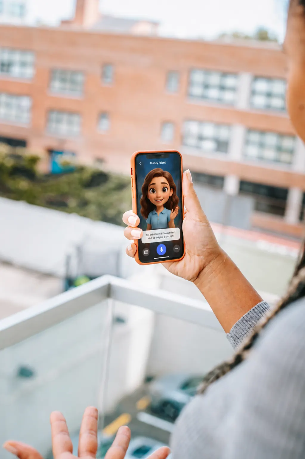 A learner holding a phone and practicing English speaking with AI